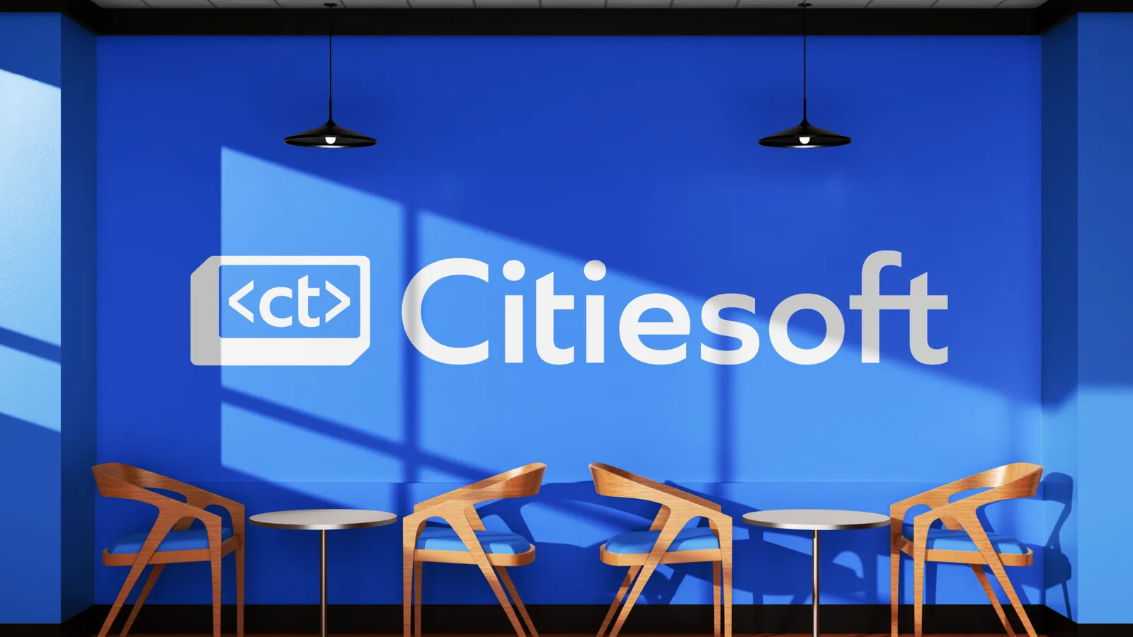 Ambiente de escritório com o azul da Citiesoft cobrindo a parede e o logotipo em relevo, com mobiliário de madeira